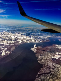 Airplane wing against sky