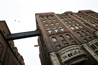 Low angle view of old building against clear sky