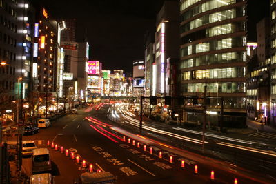 Light trails on road in city at night