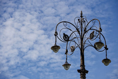 Low angle view of street light against sky