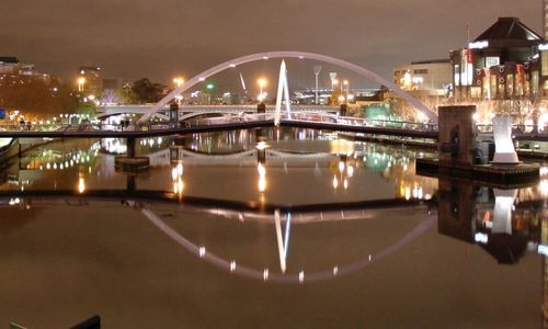 Reflection of illuminated buildings in water