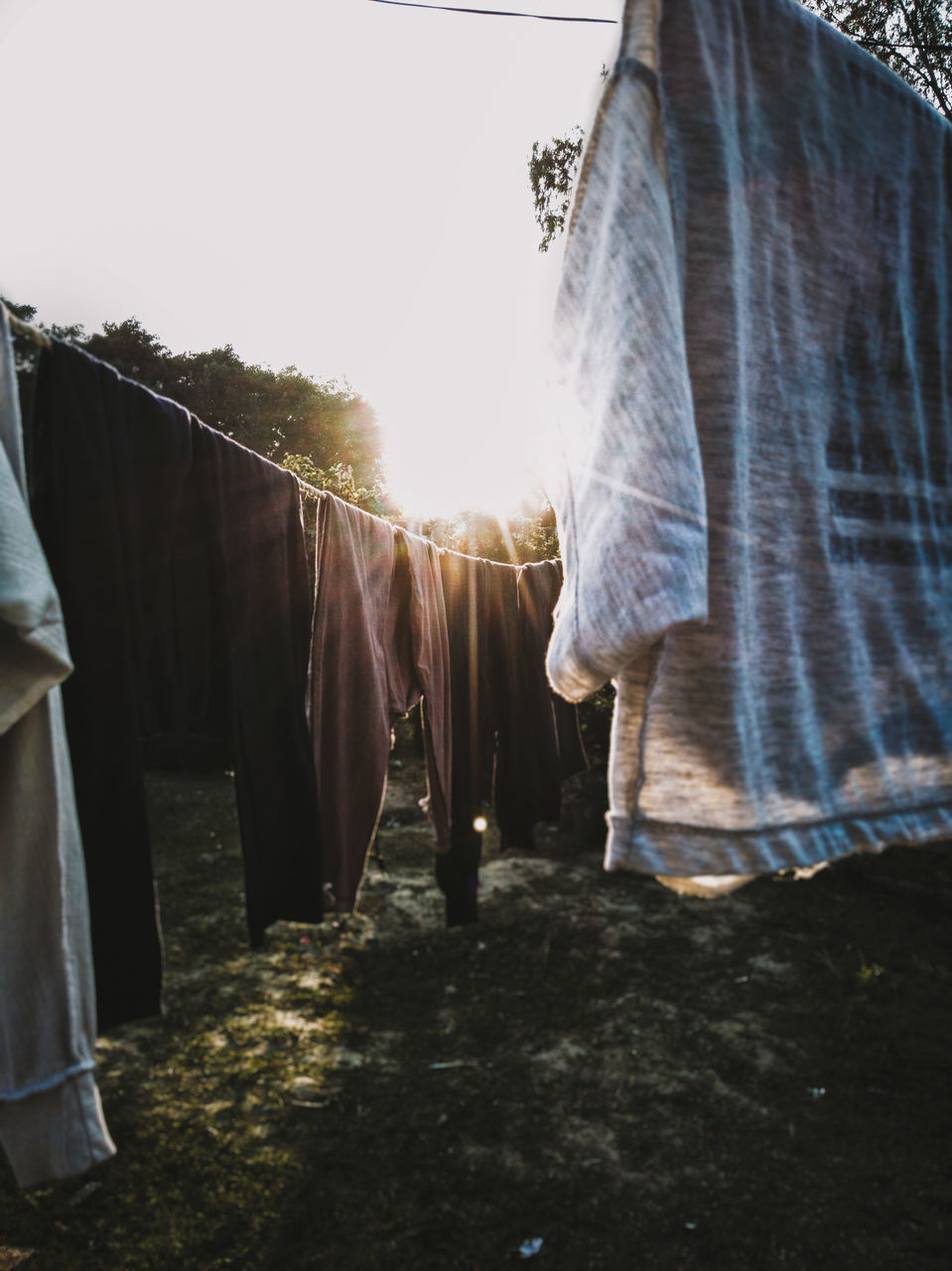 ROW OF CLOTHES DRYING ON CLOTHESLINE