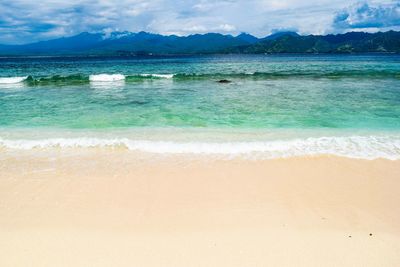 Scenic view of beach against sky