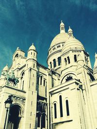 Low angle view of church against blue sky