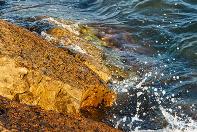 High angle view of rocks in sea