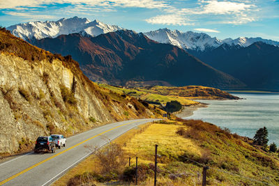 Road amidst mountains against sky