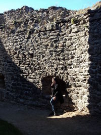 Full length of man on rock against mountain