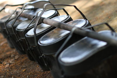 Close-up of containers in rod at camp site