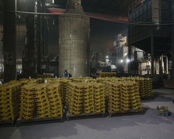 Stack of people on street by building at night