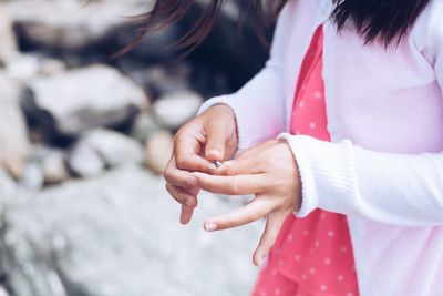 Close-up of person holding hands