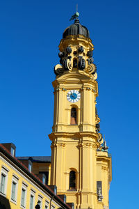 Steeple of theatiner church with clock in munich