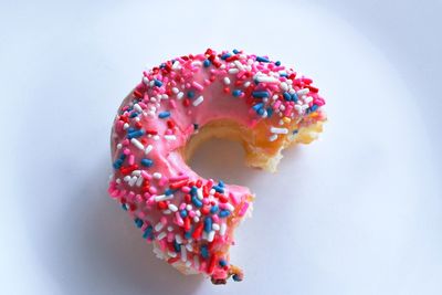 Close-up of multi colored candies against white background