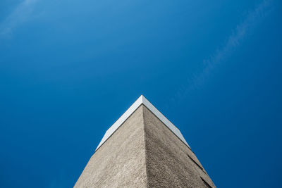 Low angle view of built structure against clear blue sky