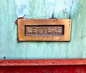 Close-up of mailbox on wall