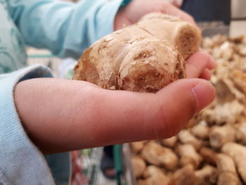 Close-up of hand holding ice cream