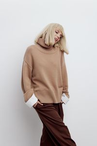 Portrait of woman standing against white background