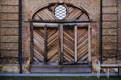 Closed wooden door of old building