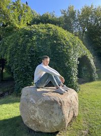 Man sitting on rock