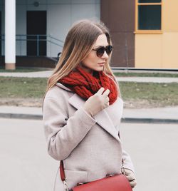 Portrait of woman with red umbrella in winter