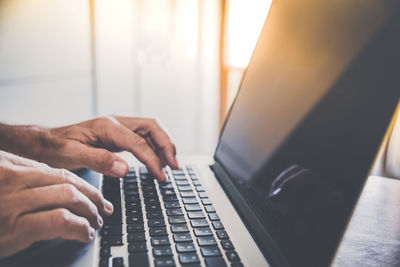 Man writing with laptop. closeup of hands typing on keyboard. technology, business, work, concept.