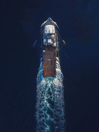 High angle view of ship on sea at night