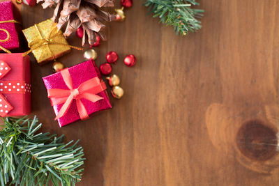 Directly above shot of christmas presents and ornaments on table