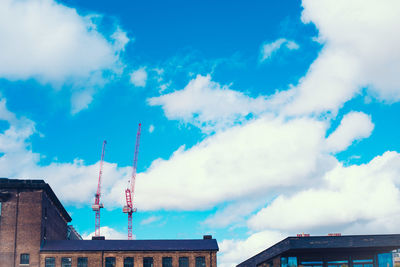 Low angle view of building against cloudy sky