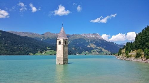 Scenic view of lake against blue sky