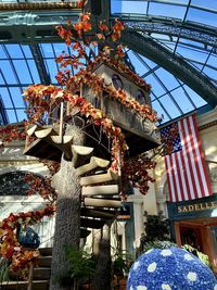 Low angle view of flags hanging against building