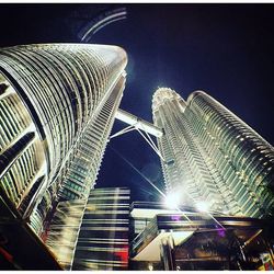 Low angle view of illuminated building at night