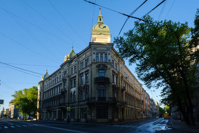 Low angle view of building against clear blue sky