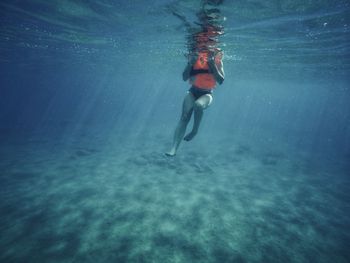 Man swimming in sea