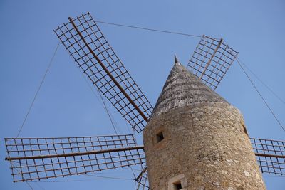 Low angle view of windmill against clear sky