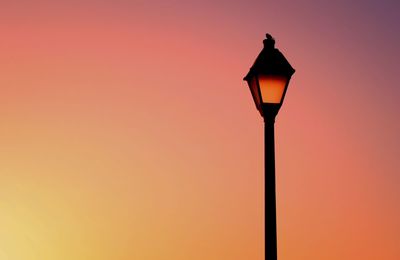 Low angle view of lamp post at night