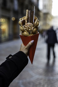 Close-up of person holding ice cream cone