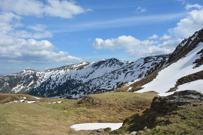 Scenic view of snowcapped mountains against sky