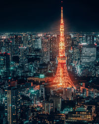 Aerial view of city lit up at night