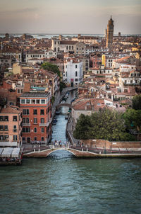 High angle view of river amidst buildings in city