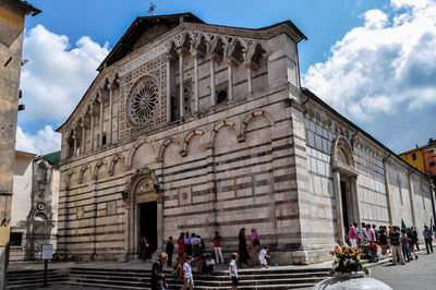 Group of people in front of historic building