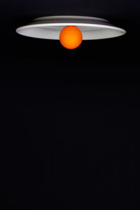 Close-up of orange ball in plate