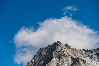 Low angle view of rock formation against sky