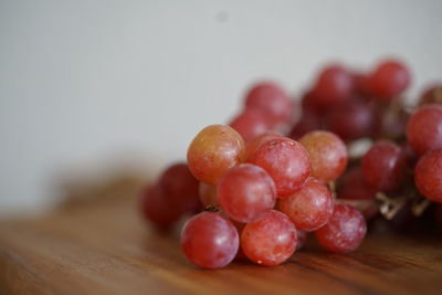 Close-up of grapes on table