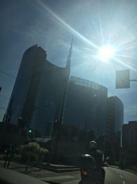 Sun shining through city