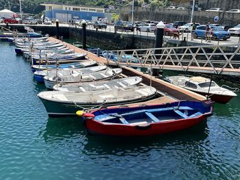 Boats moored at harbor