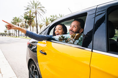 Side view of woman in car