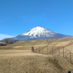 Scenic view of snowcapped mountains against clear blue sky