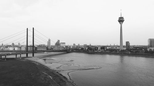 Bridge over river with buildings in background