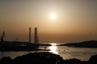 Silhouette of crane at sunset