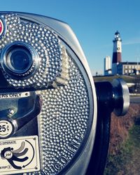 Close-up of coin-operated binoculars against montauk point