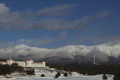 View of town against cloudy sky during winter